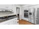 Bright kitchen features stainless appliances, white cabinetry, and solid surface countertops at 8207 Timber Ridge Rd., Conway, SC 29526