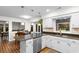 Spacious eat-in kitchen offers a granite breakfast bar, stainless steel appliances and backyard views at 8207 Timber Ridge Rd., Conway, SC 29526