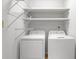 Convenient laundry room with a washer, dryer, and plenty of shelf space at 8207 Timber Ridge Rd., Conway, SC 29526