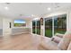 Inviting living room boasts hardwood floors, an entertainment center and an exterior view at 8207 Timber Ridge Rd., Conway, SC 29526