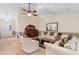 Bright living room with a high ceiling, wood floors, and classic furniture at 8207 Timber Ridge Rd., Conway, SC 29526