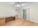 Well-lit office with wood floors, a built-in desk, and doorway entrance at 8207 Timber Ridge Rd., Conway, SC 29526