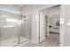 Bright bathroom featuring a glass-enclosed shower and doorway to bedroom at 846 Ireland Dr., Longs, SC 29568