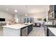 Modern kitchen with a large island, stainless steel appliances, and an open layout to the dining and living areas at 846 Ireland Dr., Longs, SC 29568