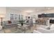 Inviting living space with a comfortable sofa, natural light, and open flow to the kitchen and dining area at 846 Ireland Dr., Longs, SC 29568