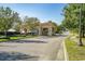 Elegant community entrance with terracotta roof and manicured landscaping welcomes you to your new home at 9485 Ronda Ct., Myrtle Beach, SC 29579
