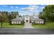Beautiful one-story home with manicured lawn, symmetrical curb appeal and elegant white stucco exterior at 9485 Ronda Ct., Myrtle Beach, SC 29579