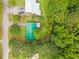 Aerial view of the property showing a green-roofed building amid lush greenery at 96 Middleton Rd., Andrews, SC 29510