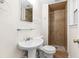 Updated bathroom with tiled shower, updated fixtures, and a pedestal sink at 96 Middleton Rd., Andrews, SC 29510