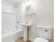 Full bathroom featuring a shower-tub combo, pedestal sink, and modern toilet at 96 Middleton Rd., Andrews, SC 29510