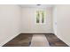 A simple, clean bedroom with wood-look flooring, one window and neutral walls at 96 Middleton Rd., Andrews, SC 29510