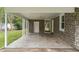 Attached carport featuring stone accents, offering convenient covered parking and access to the home at 96 Middleton Rd., Andrews, SC 29510
