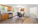 Dining area with natural lighting, updated floors, and a view into the kitchen at 96 Middleton Rd., Andrews, SC 29510
