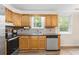 Bright kitchen with stainless steel appliances, wood cabinets, and a view of the backyard at 96 Middleton Rd., Andrews, SC 29510