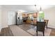 Well-lit kitchen features stainless steel appliances, wood cabinets, and adjacent dining area at 96 Middleton Rd., Andrews, SC 29510
