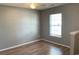 A well lit living room features wood floors and a window at 962 Willow Bend Dr., Myrtle Beach, SC 29579