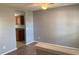 An open-concept living room offers wood floors and a view into the kitchen at 962 Willow Bend Dr., Myrtle Beach, SC 29579