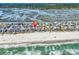 Aerial view of beach homes on stilts with ocean on one side and river on the other at 969 S Waccamaw Dr., Garden City Beach, SC 29576