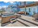 Spacious outdoor deck with a hot tub and comfortable seating area overlooking the ocean at 969 S Waccamaw Dr., Garden City Beach, SC 29576