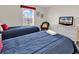 Well-lit bedroom featuring twin beds, coastal decor, and a charming, comfortable atmosphere at 969 S Waccamaw Dr., Garden City Beach, SC 29576