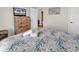 Bedroom featuring a king bed, beach decor, and door to the hallway at 969 S Waccamaw Dr., Garden City Beach, SC 29576