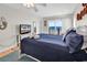 Bedroom featuring a king bed, water view, and flat screen tv at 969 S Waccamaw Dr., Garden City Beach, SC 29576