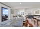 Open living area that seamlessly blends indoor/outdoor living with kitchen/dining areas and ocean views at 969 S Waccamaw Dr., Garden City Beach, SC 29576