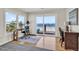 Bright sitting area with view of the beach, desks, and natural light at 969 S Waccamaw Dr., Garden City Beach, SC 29576