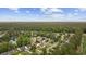 Aerial image shows home with surrounding area, wooded lots and bodies of water at 9831 Winchester Ct., Murrells Inlet, SC 29576