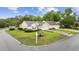 Corner lot featuring a well-maintained lawn and landscaping that enhances its curb appeal at 9831 Winchester Ct., Murrells Inlet, SC 29576
