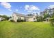 Beautifully landscaped backyard features a lush green lawn and view of the house at 9831 Winchester Ct., Murrells Inlet, SC 29576