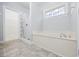 Bathroom with tub, shower, and patterned window at 9831 Winchester Ct., Murrells Inlet, SC 29576