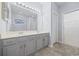Bathroom featuring a large mirror, dual sinks, and tile floor at 9831 Winchester Ct., Murrells Inlet, SC 29576