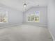 Bedroom with two windows, ceiling fan, and vaulted ceiling at 9831 Winchester Ct., Murrells Inlet, SC 29576