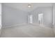 Bedroom with a vaulted ceiling, windows and doorway to ensuite bath at 9831 Winchester Ct., Murrells Inlet, SC 29576