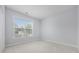 Bright bedroom featuring a large window and neutral carpet at 9831 Winchester Ct., Murrells Inlet, SC 29576