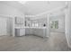 Open kitchen featuring marble countertops, gray cabinetry, and wood-look flooring at 9831 Winchester Ct., Murrells Inlet, SC 29576