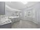 Open concept kitchen with gray cabinetry, marble counters, and wood-look floors at 9831 Winchester Ct., Murrells Inlet, SC 29576