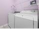 Convenient laundry room with appliances and shelving for an organized space at 9831 Winchester Ct., Murrells Inlet, SC 29576