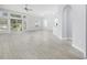 Spacious living room with generous windows, an open floorplan, and easy access to the backyard at 9831 Winchester Ct., Murrells Inlet, SC 29576