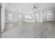 Spacious living room with plenty of natural light, hard flooring, and neutral wall color at 9831 Winchester Ct., Murrells Inlet, SC 29576