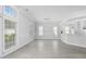 Bright living room with large windows and modern wood-look flooring at 9831 Winchester Ct., Murrells Inlet, SC 29576
