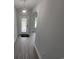 Inviting foyer with a decorative light fixture and wood-look floors throughout at Tbd 7 Duford Rd., Nichols, SC 29581