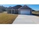 Charming single-story home featuring a two-car garage and a well-manicured front lawn at Tbd 7 Duford Rd., Nichols, SC 29581