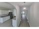 Hallway view into a kitchen with stainless steel appliances and granite countertops at Tbd 7 Duford Rd., Nichols, SC 29581