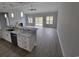 Open-concept living area with a kitchen island, fireplace, and sliding glass doors at Tbd 7 Duford Rd., Nichols, SC 29581