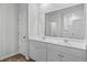 Bathroom featuring double vanity with white cabinets and a large mirror at 1004 Sentinel Ct., Little River, SC 29566