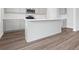Stylish kitchen island with quartz countertop, shaker cabinets, and modern appliances at 1013 Kinness Dr., Conway, SC 29527
