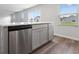 Well-lit kitchen featuring stainless steel appliances, gray cabinets, and light countertops at 1013 Kinness Dr., Conway, SC 29527