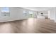 Bright living room flows into the kitchen with hardwood flooring and access to the backyard at 1013 Kinness Dr., Conway, SC 29527